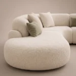 Duvel Curved Sofa in beige bouclé by Marina Living UAE