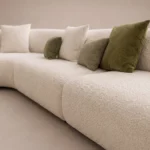 Duvel Curved Sofa in beige bouclé by Marina Living UAE
